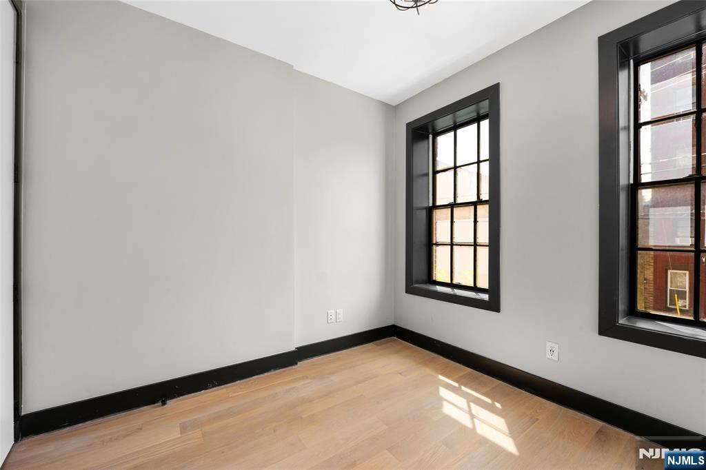 208 15th Street Jersey City, NJ 07310 - Photo 45 of 46 an empty room with windows