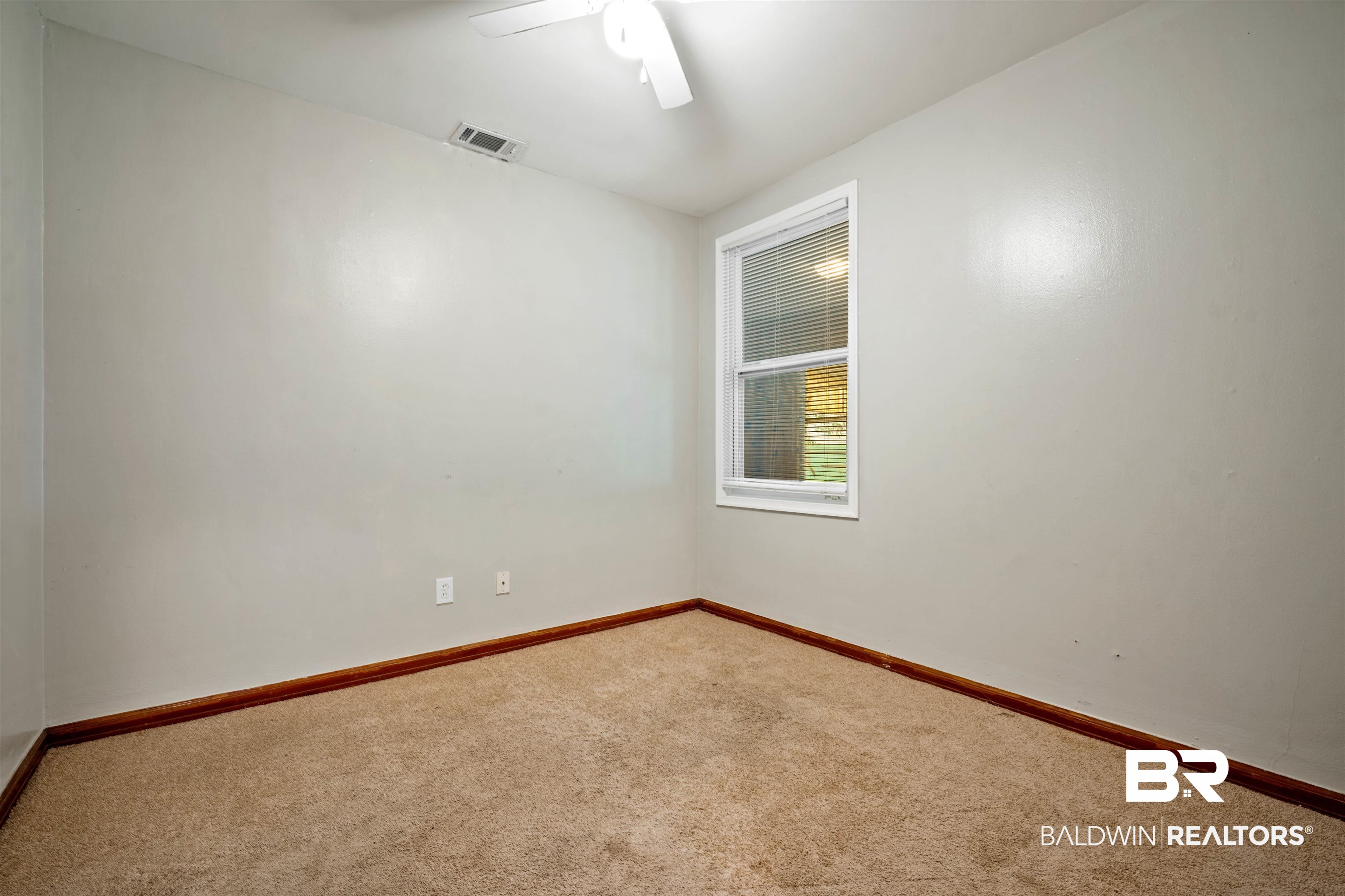 9 Elizabeth Avenue Mobile, AL 36611 - Photo 11 of 19 Unfurnished room with carpet floors and a ceiling fan