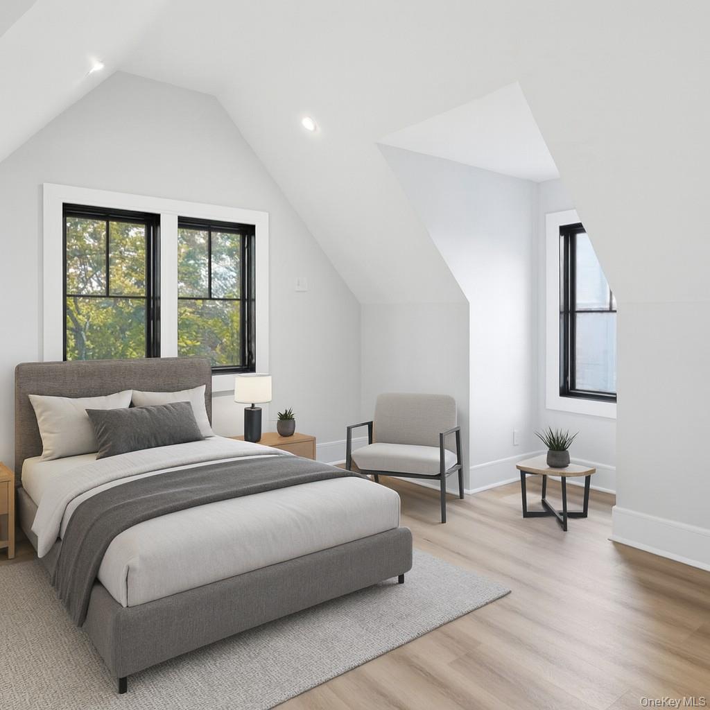 34 Clinton Avenue, Unit 10 Dobbs Ferry, NY 10522 - Photo 11 of 14 a bedroom with a bed wooden floor and window