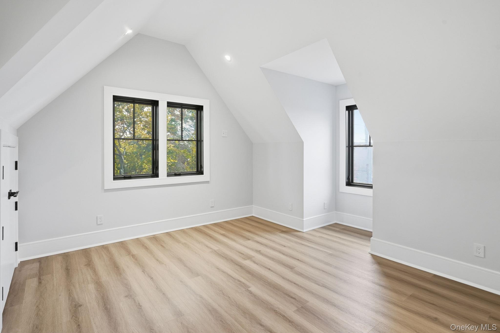 34 Clinton Avenue, Unit 10 Dobbs Ferry, NY 10522 - Photo 12 of 14 an empty room with wooden floor and windows