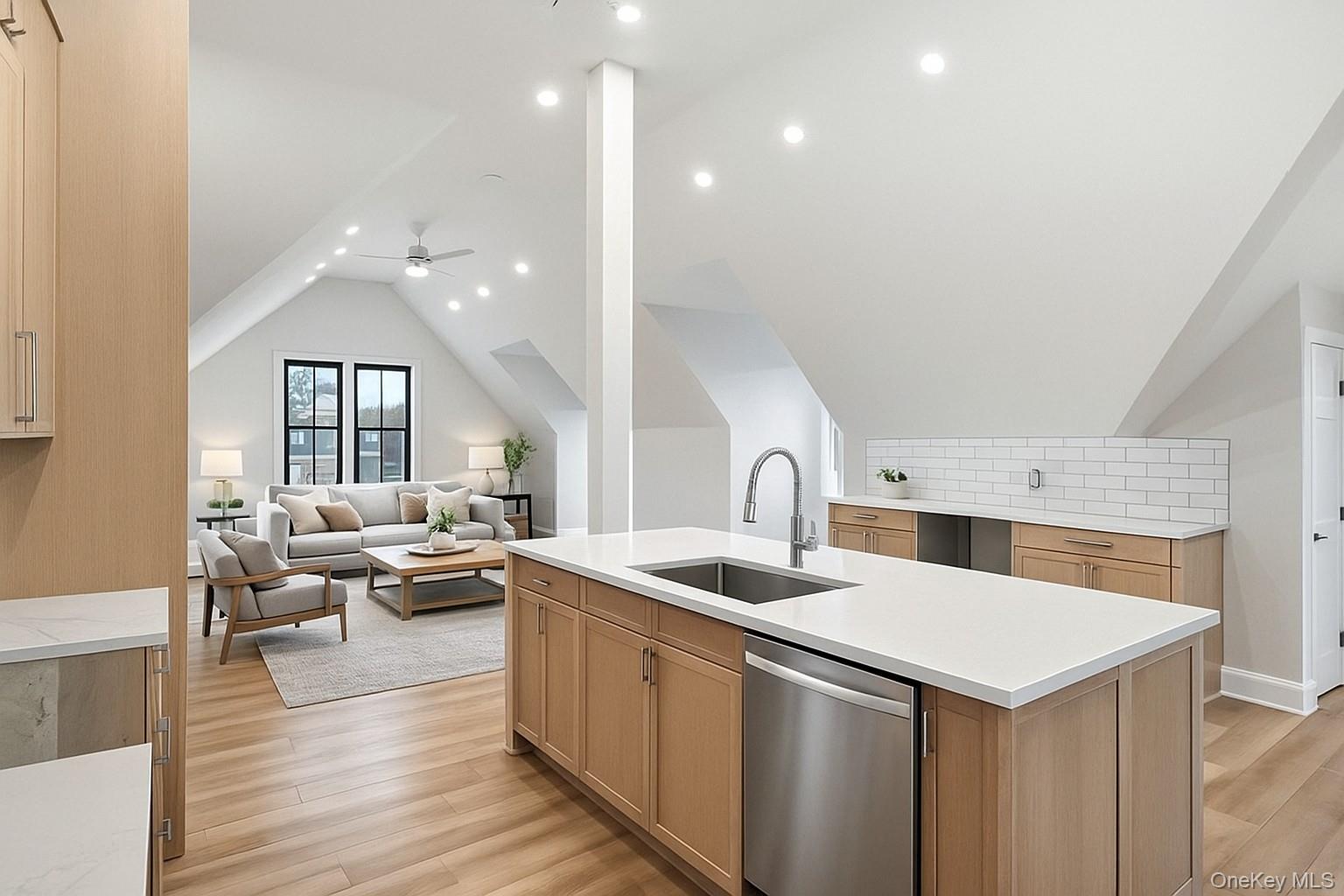 34 Clinton Avenue, Unit 10 Dobbs Ferry, NY 10522 - Photo 3 of 14 a kitchen with a stove a sink and living room with a large window