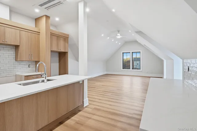 a view of a kitchen with a sink and dishwasher