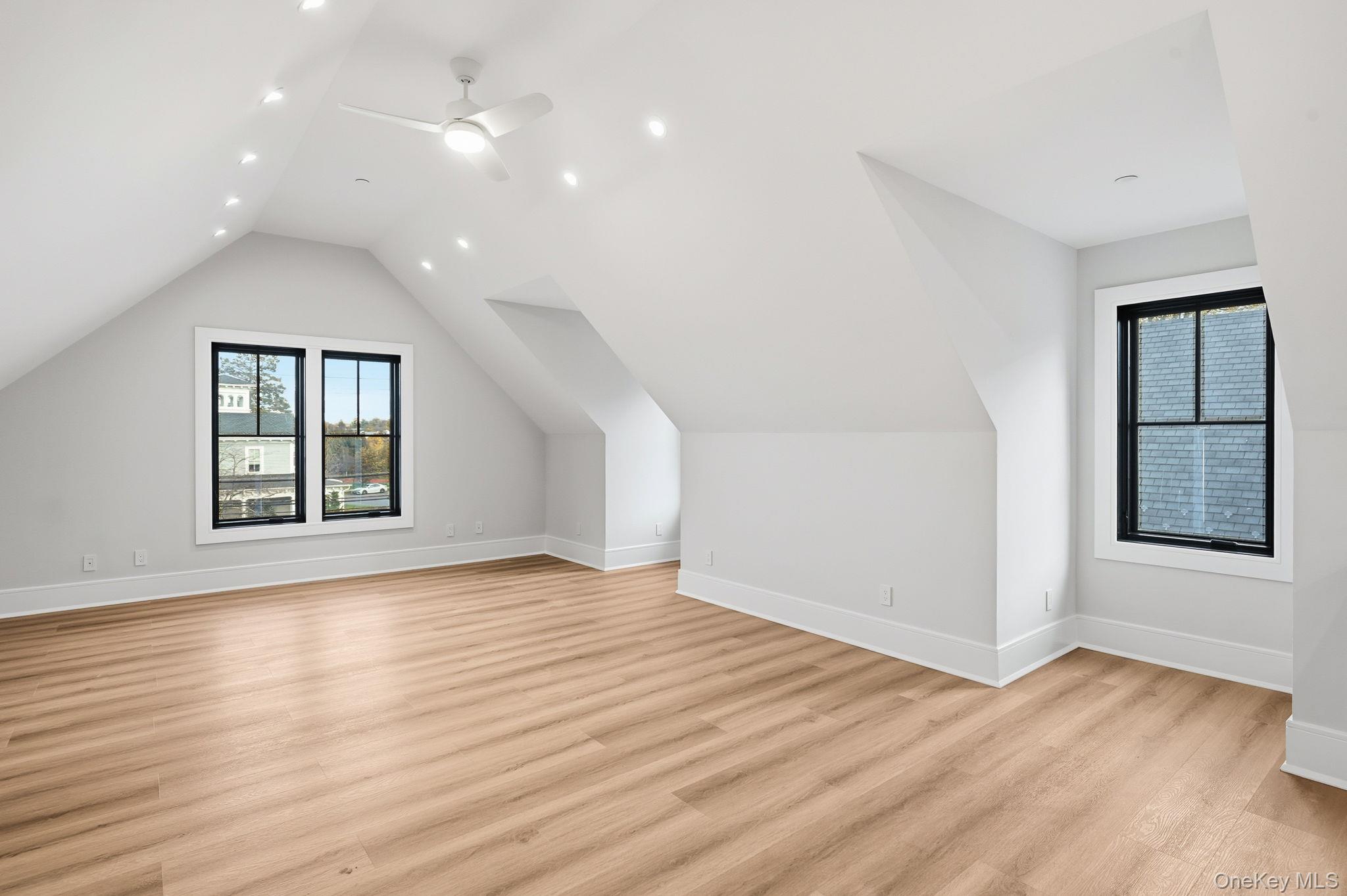34 Clinton Avenue, Unit 10 Dobbs Ferry, NY 10522 - Photo 6 of 14 an empty room with wooden floor and windows
