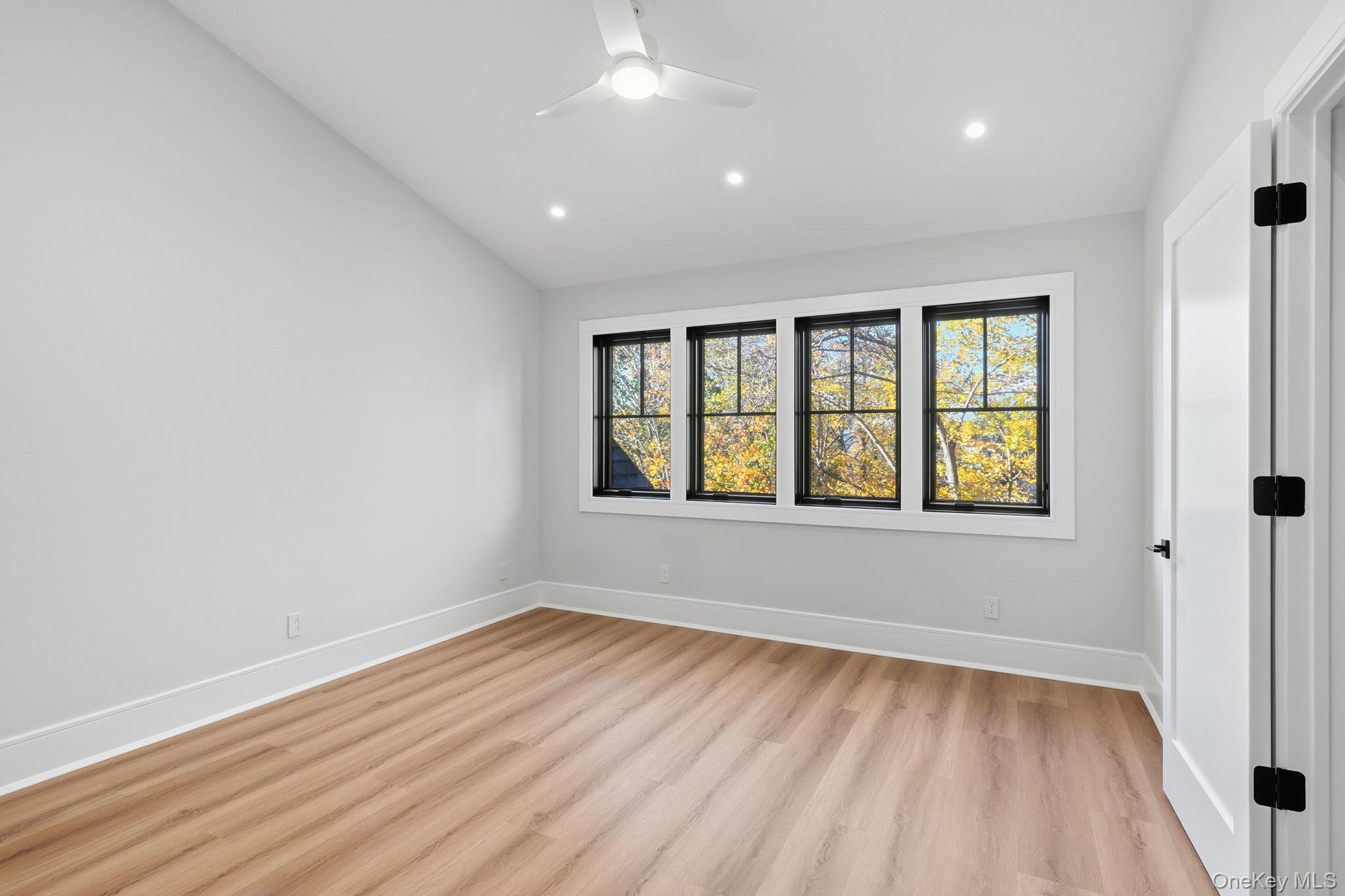 34 Clinton Avenue, Unit 10 Dobbs Ferry, NY 10522 - Photo 8 of 14 an empty room with wooden floor and windows