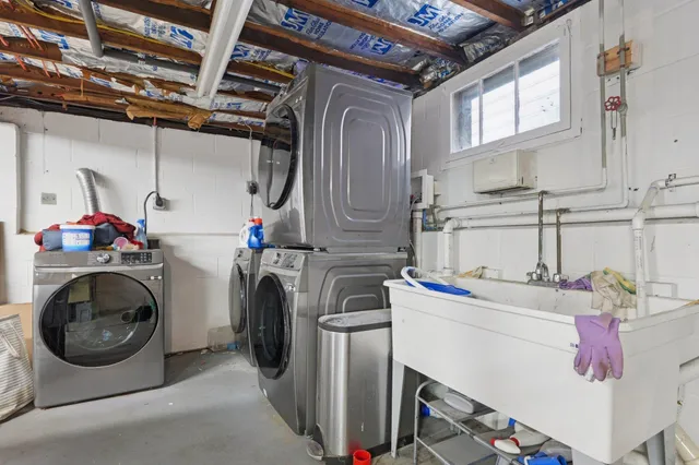 a view of a backyard with plants and swing