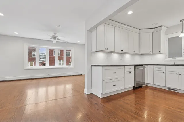 a view of a kitchen with cabinet and a window