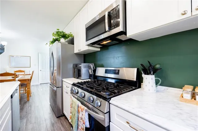 a kitchen with a stove and a microwave