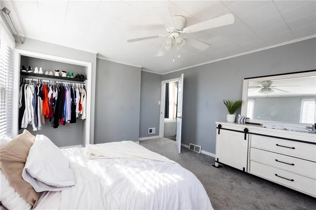 a bedroom with a bed and a dresser