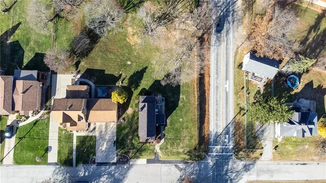 front view of a house with a tree