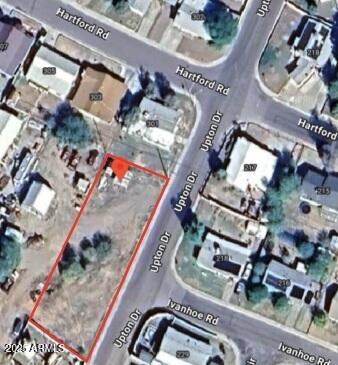 an aerial view of a residential apartment building with a yard