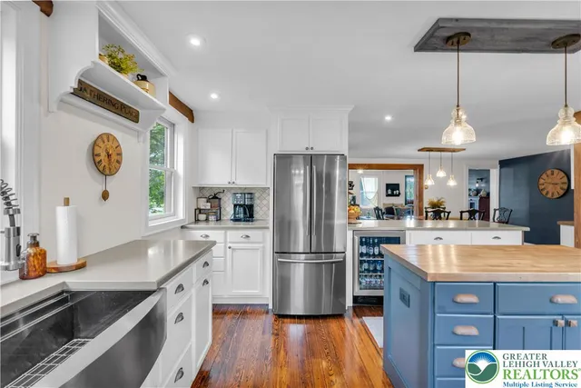 a bathroom with a sink toilet and a mirror