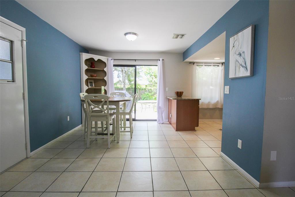 1116 Royal Road Venice, FL 34293 - Photo 11 of 26 a view of a kitchen with dining area and windows