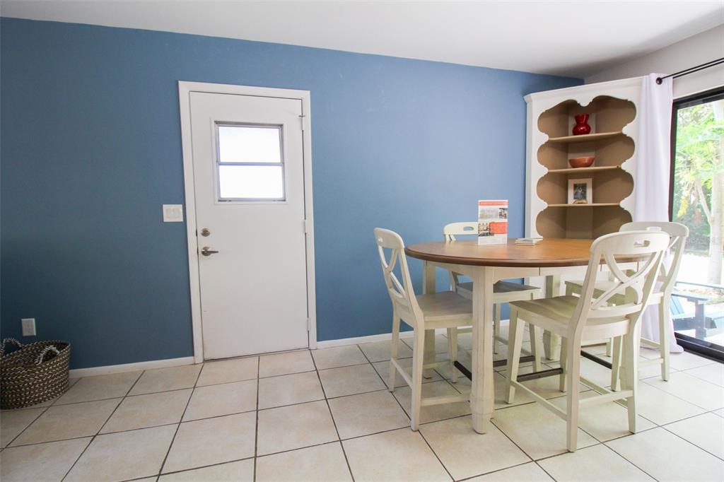 1116 Royal Road Venice, FL 34293 - Photo 12 of 26 a dining room with furniture and window