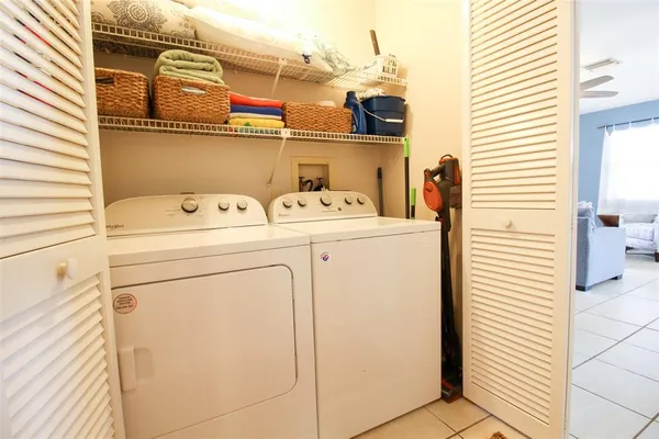 a utility room with dryer and washer