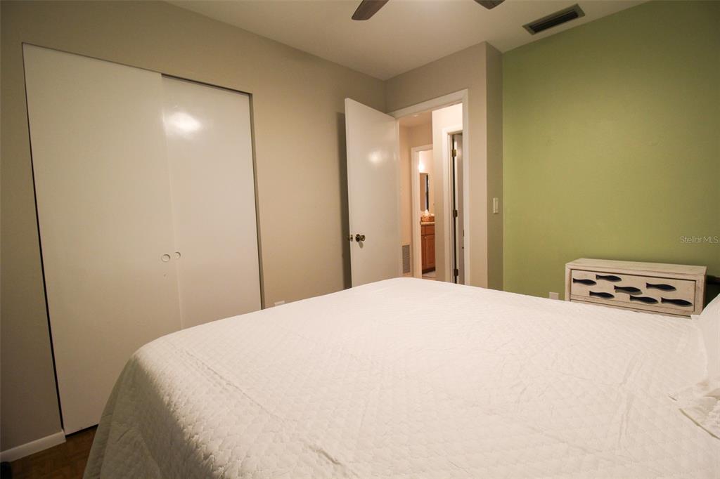 1116 Royal Road Venice, FL 34293 - Photo 25 of 26 a bedroom with a bed and a lamp