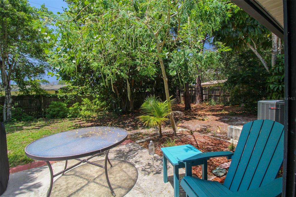 1116 Royal Road Venice, FL 34293 - Photo 4 of 26 a view of a chairs and table in backyard of the house