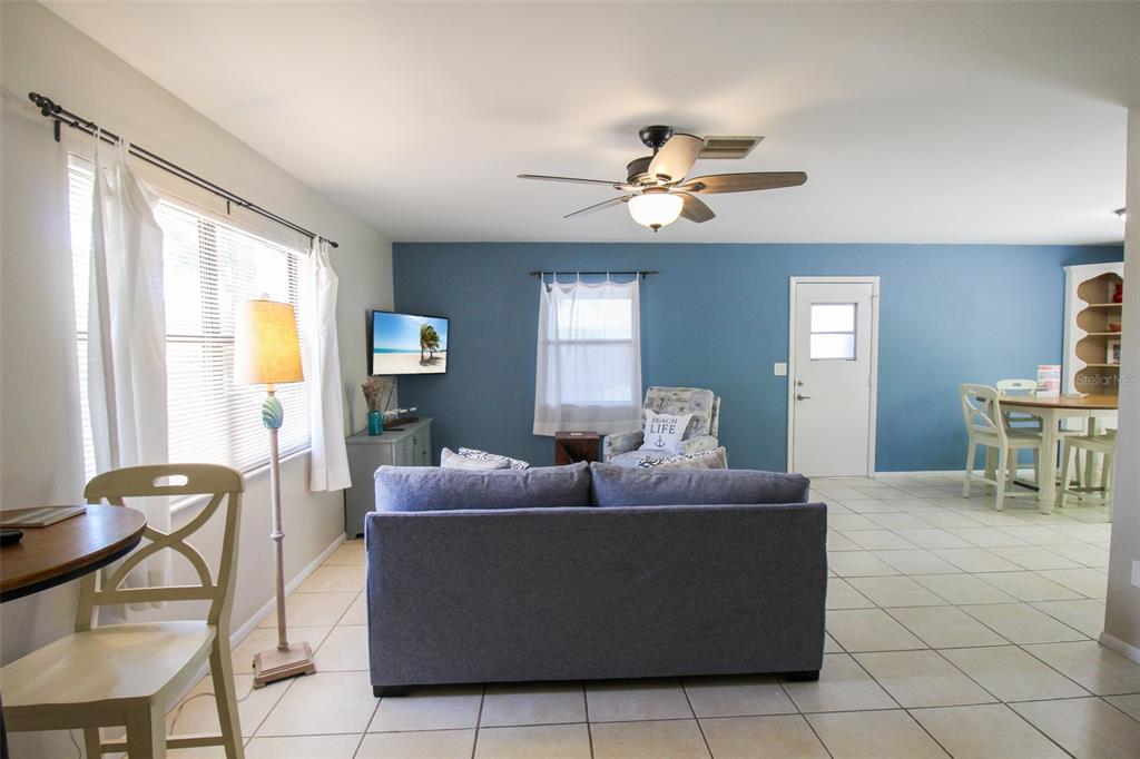 1116 Royal Road Venice, FL 34293 - Photo 6 of 26 a living room with furniture and a large window