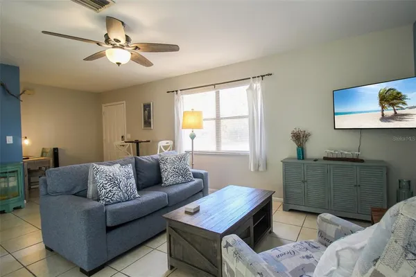 a living room with furniture and a window