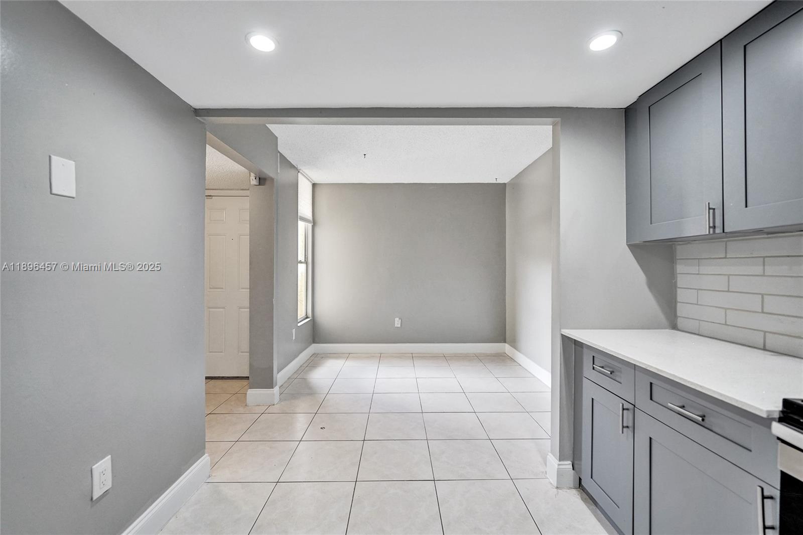 8401 West Sample Road, Unit 20 Coral Springs, FL 33065 - Photo 17 of 61 a view of kitchen with white cabinets