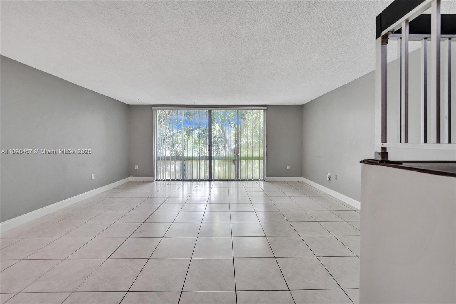 8401 West Sample Road, Unit 20 Coral Springs, FL 33065 - Photo 19 of 61 a view of an empty room with a window
