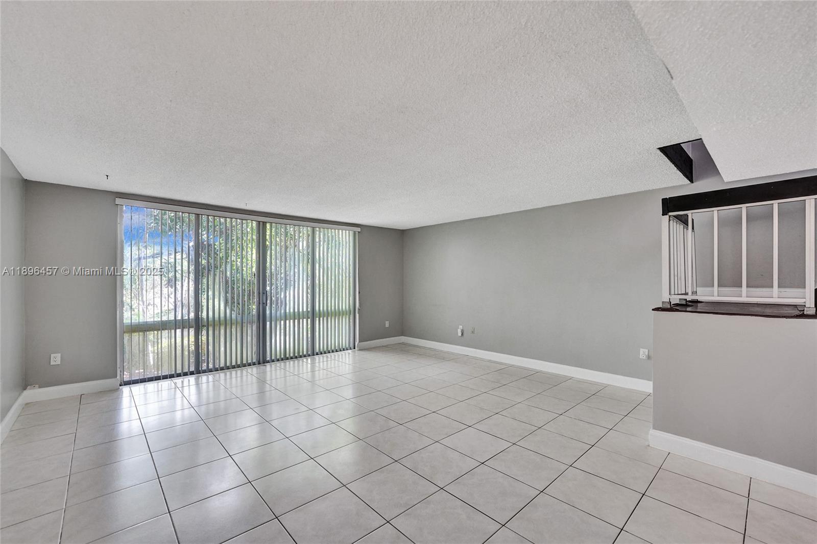 8401 West Sample Road, Unit 20 Coral Springs, FL 33065 - Photo 21 of 61 a view of an empty room with a window