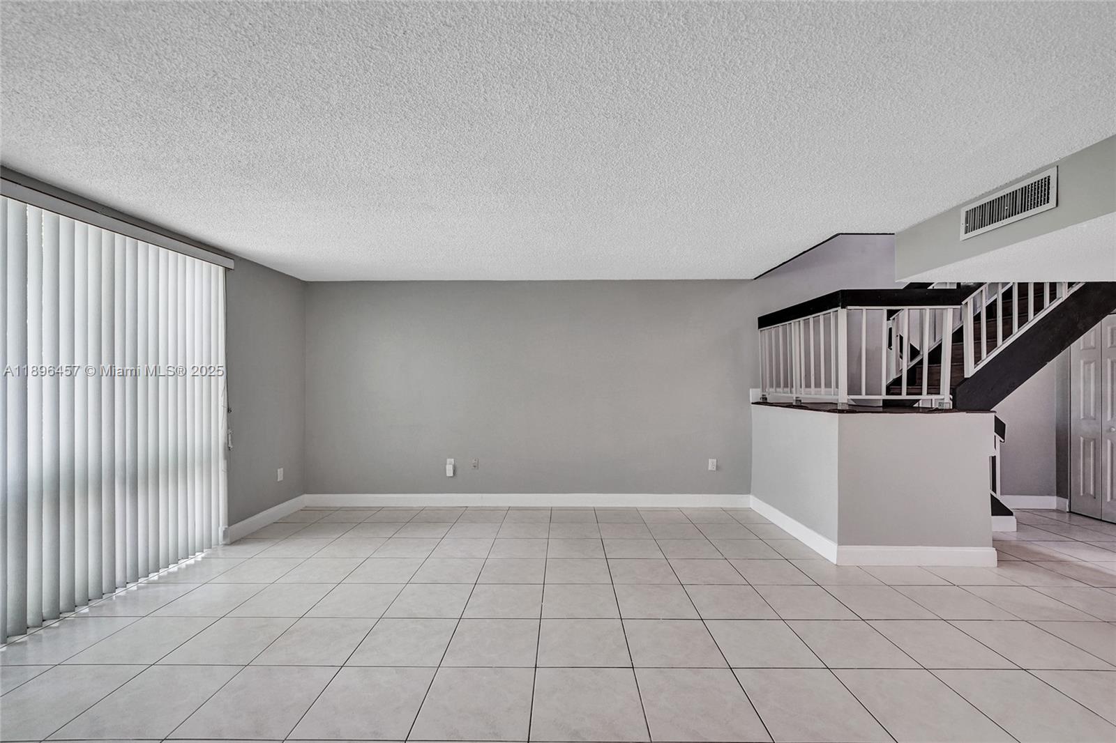 8401 West Sample Road, Unit 20 Coral Springs, FL 33065 - Photo 22 of 61 a view of an empty room with stairs