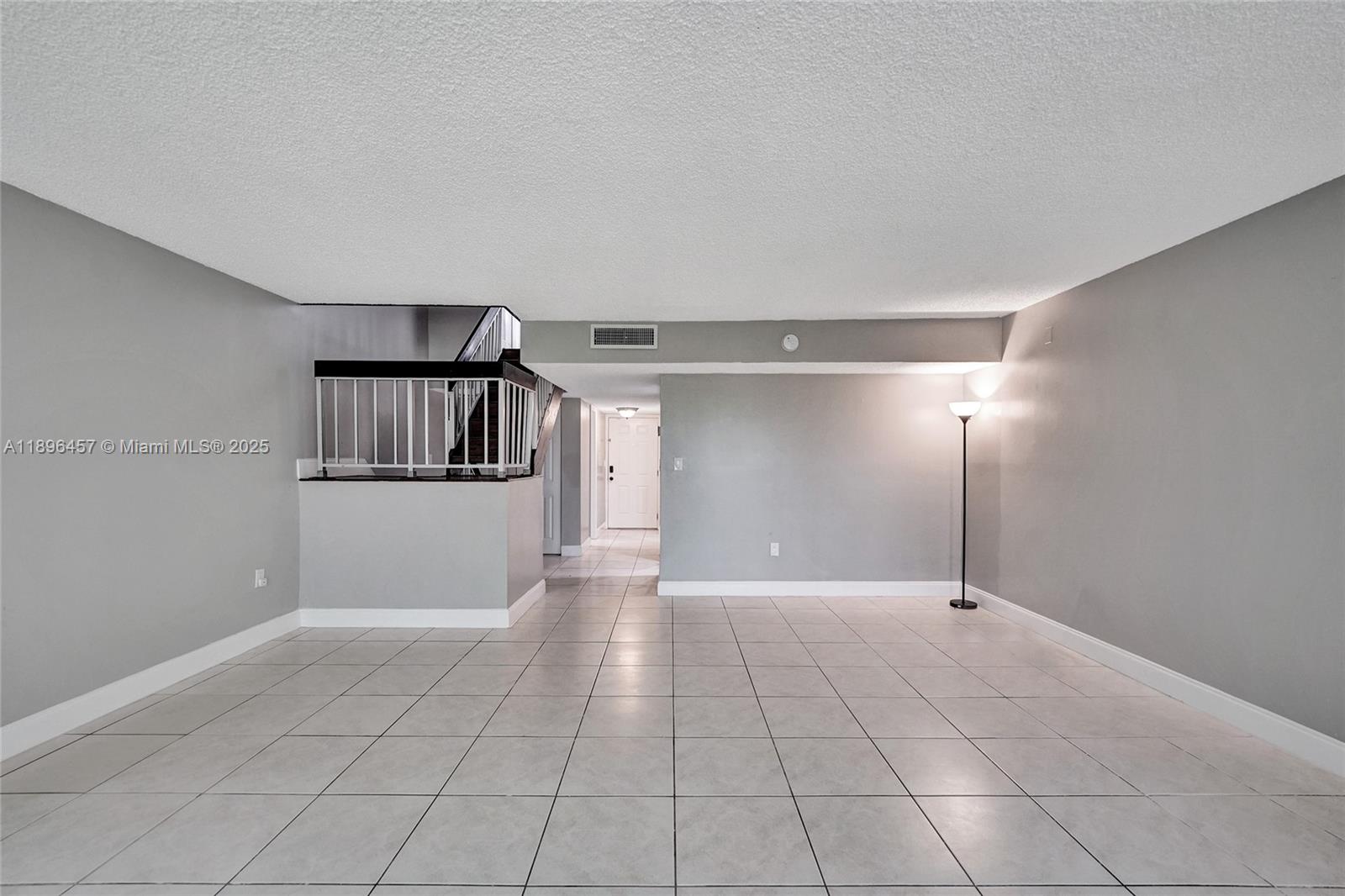 8401 West Sample Road, Unit 20 Coral Springs, FL 33065 - Photo 24 of 61 a view of a big room with a chandeliers