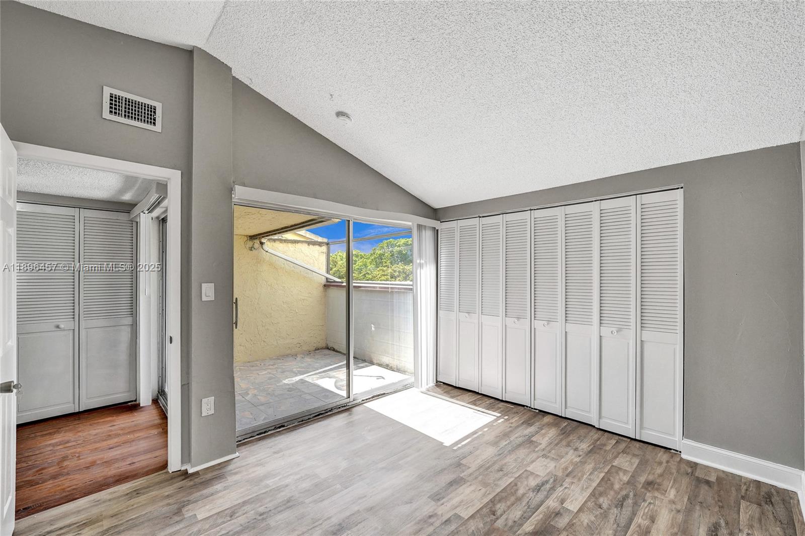 8401 West Sample Road, Unit 20 Coral Springs, FL 33065 - Photo 30 of 61 a view of entryway with wooden floor