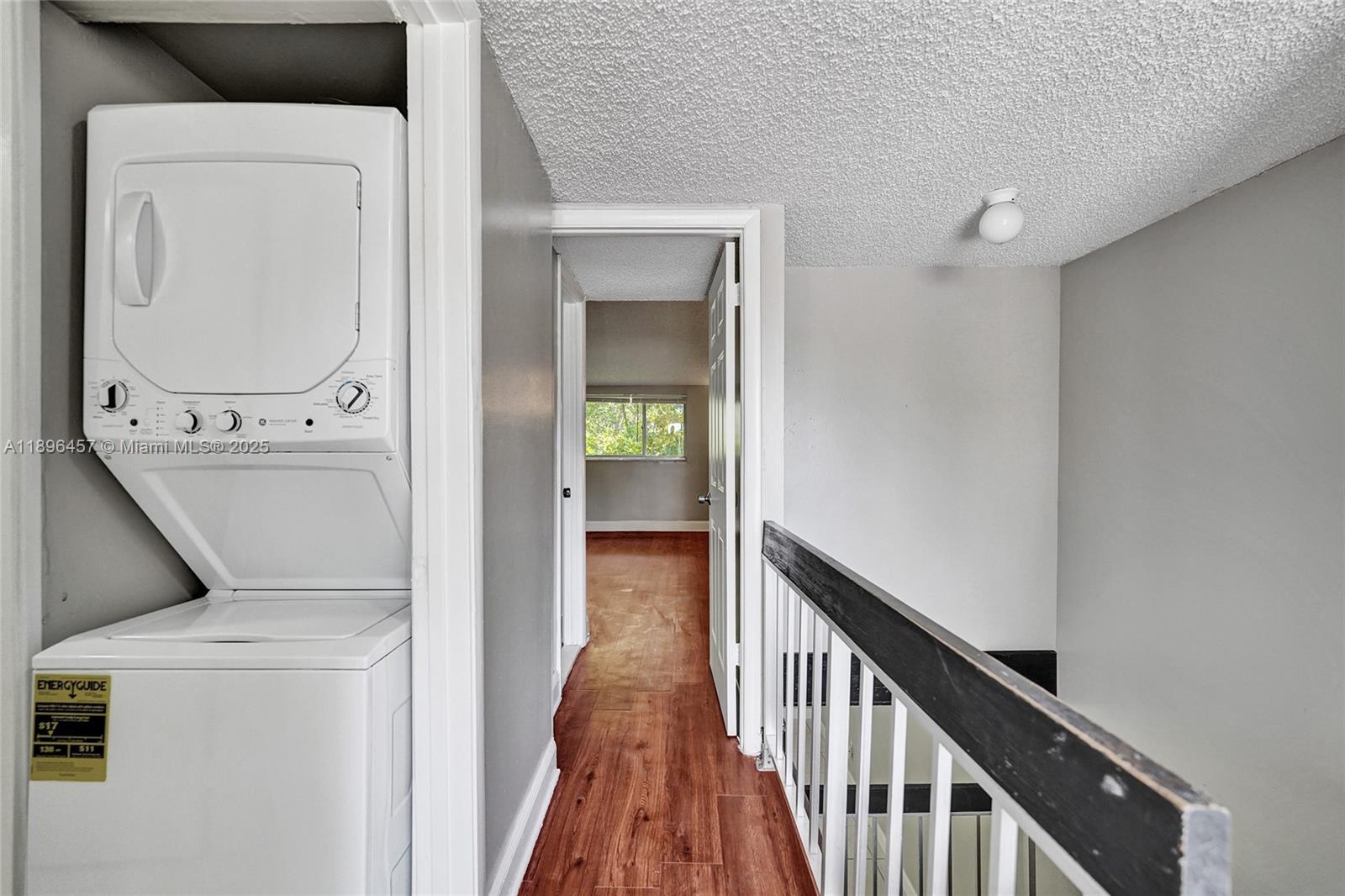 8401 West Sample Road, Unit 20 Coral Springs, FL 33065 - Photo 35 of 61 a view of a hallway with washer and dryer