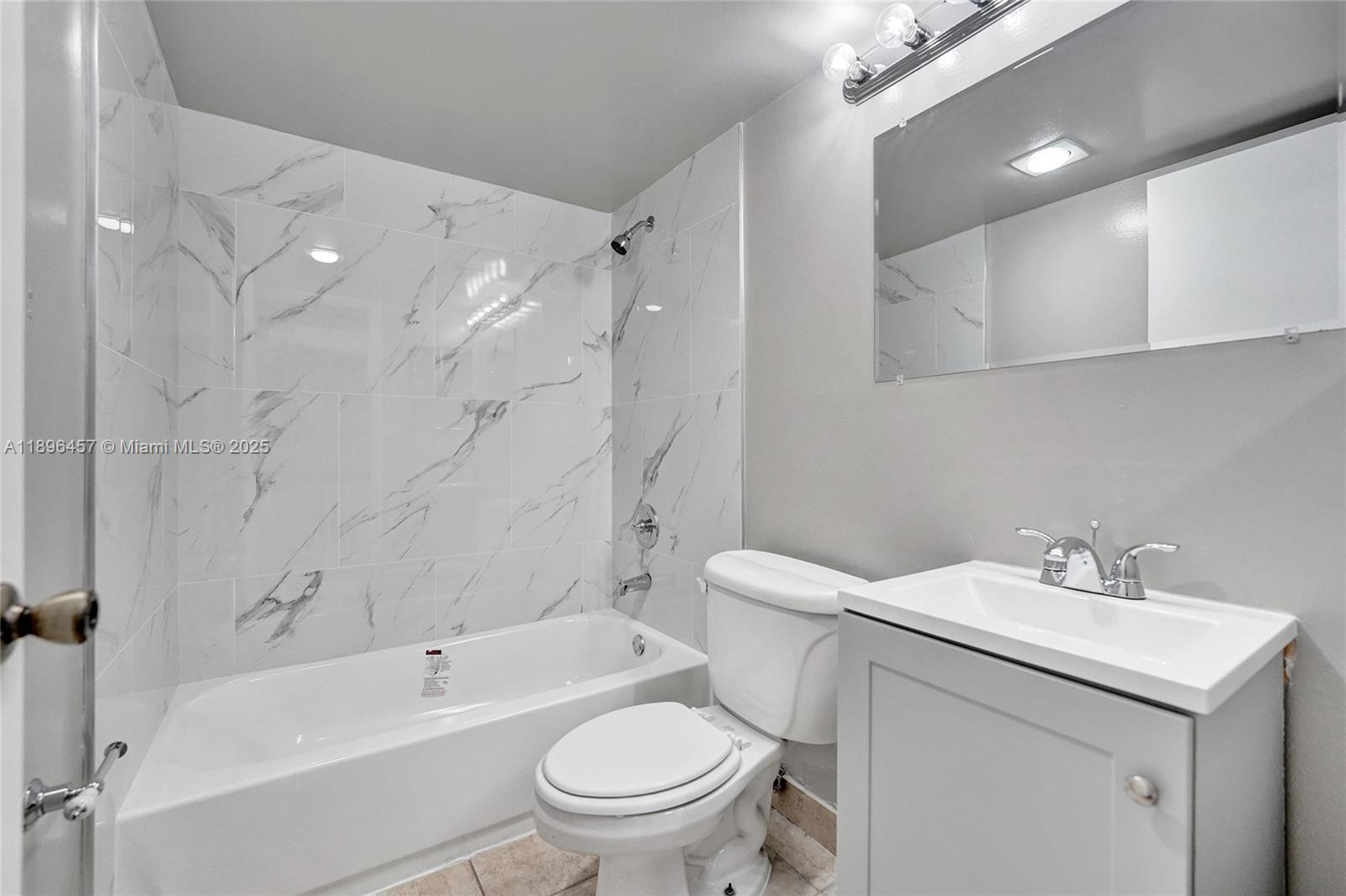 8401 West Sample Road, Unit 20 Coral Springs, FL 33065 - Photo 37 of 61 a bathroom with a sink toilet and shower