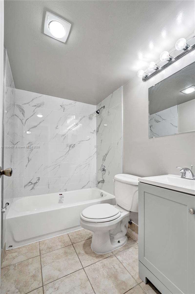 8401 West Sample Road, Unit 20 Coral Springs, FL 33065 - Photo 38 of 61 a bathroom with a sink a toilet and shower