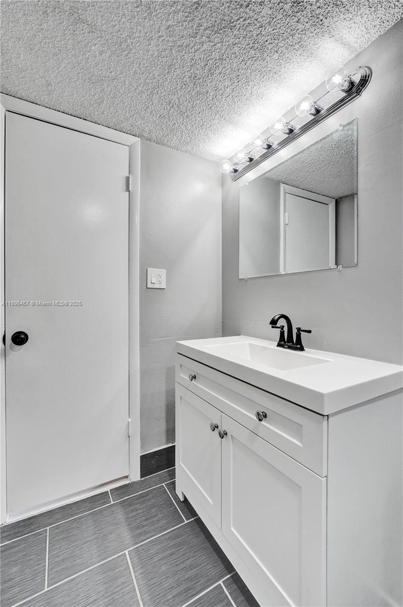 8401 West Sample Road, Unit 20 Coral Springs, FL 33065 - Photo 50 of 61 a view of bathroom with dual sinks