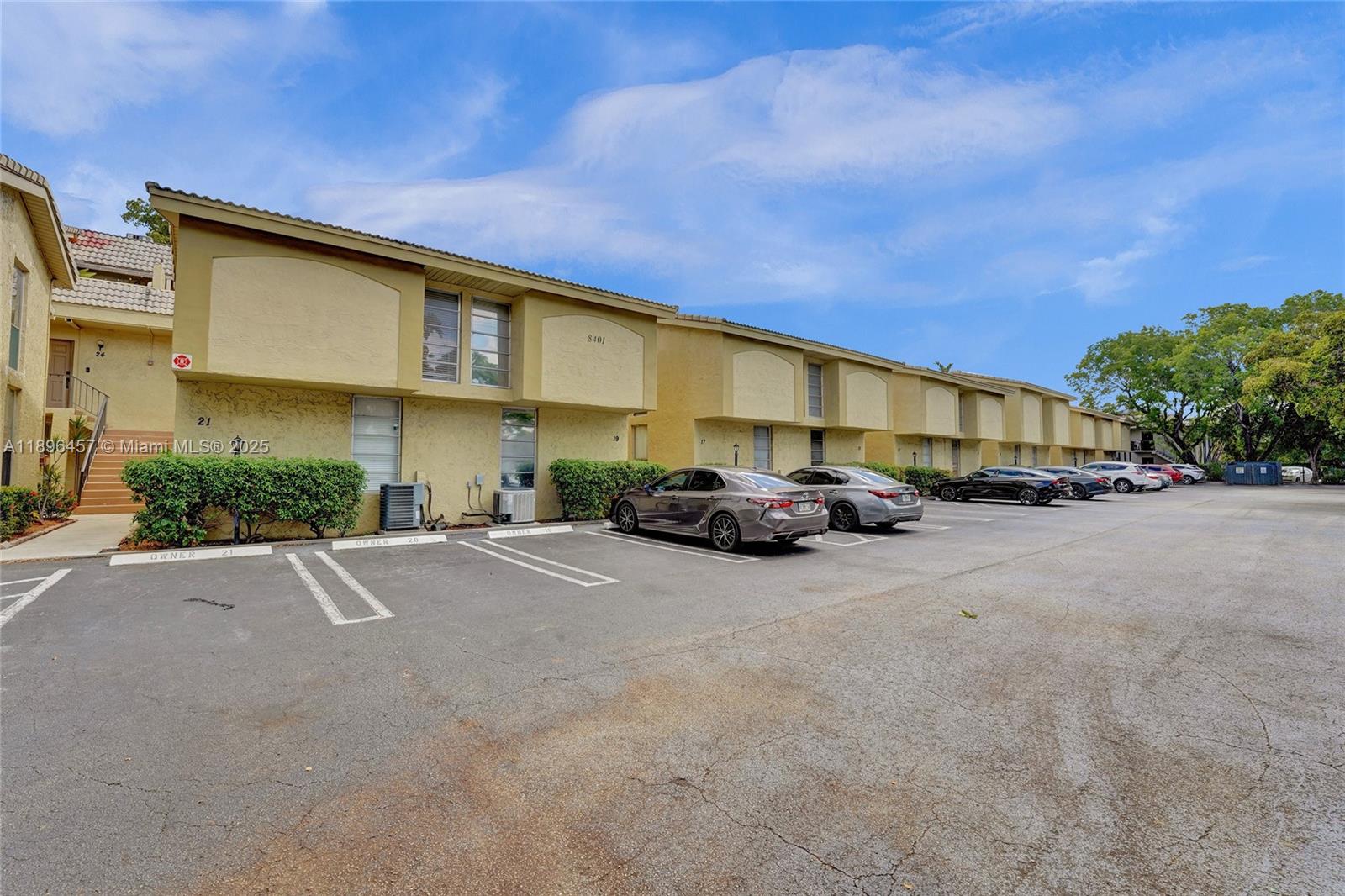 8401 West Sample Road, Unit 20 Coral Springs, FL 33065 - Photo 56 of 61 a view of car parked in front of house