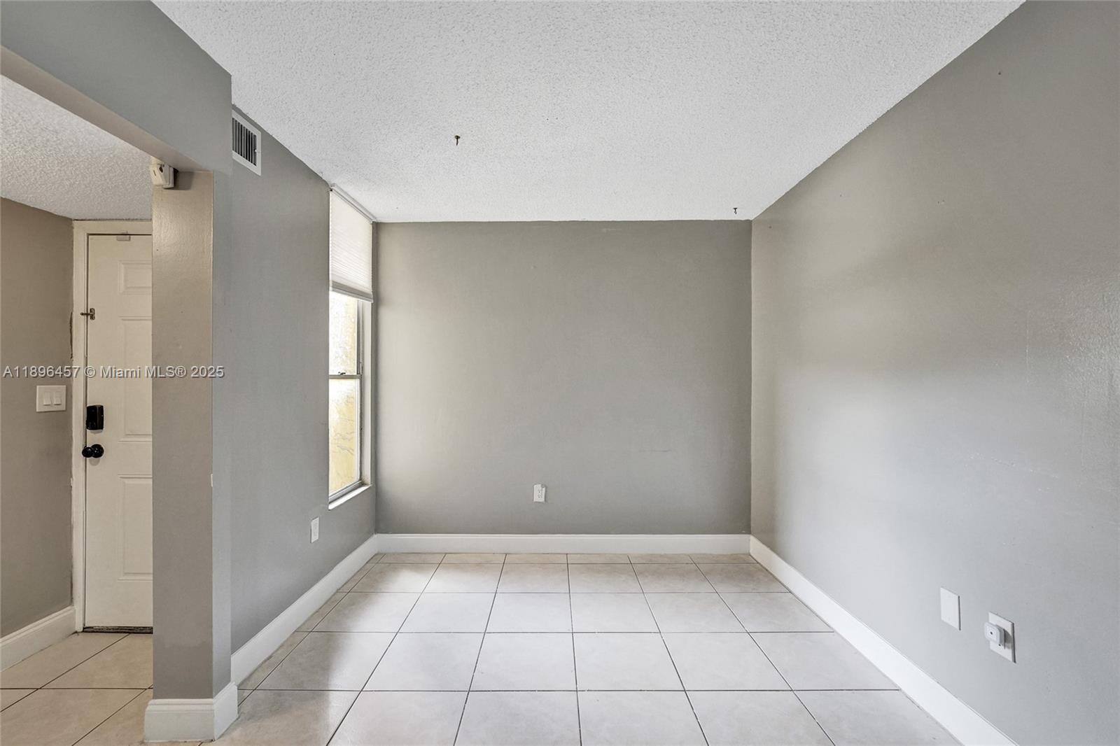 8401 West Sample Road, Unit 20 Coral Springs, FL 33065 - Photo 7 of 61 a view of a room with an empty space and a window