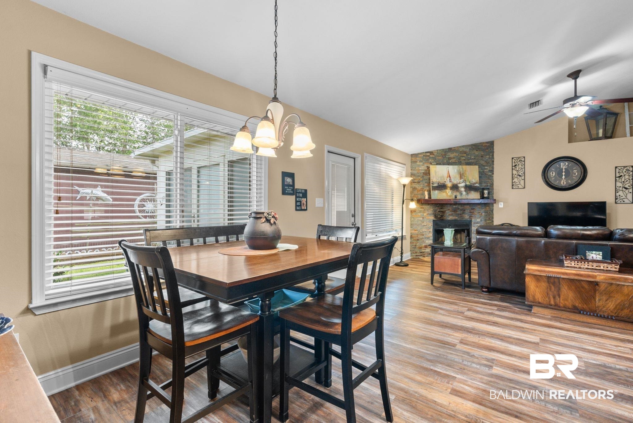 562 Vestige Mews Foley, AL 36535 - Photo 21 of 54 Dining area with wood-finish flooring and a multi-light chandelier