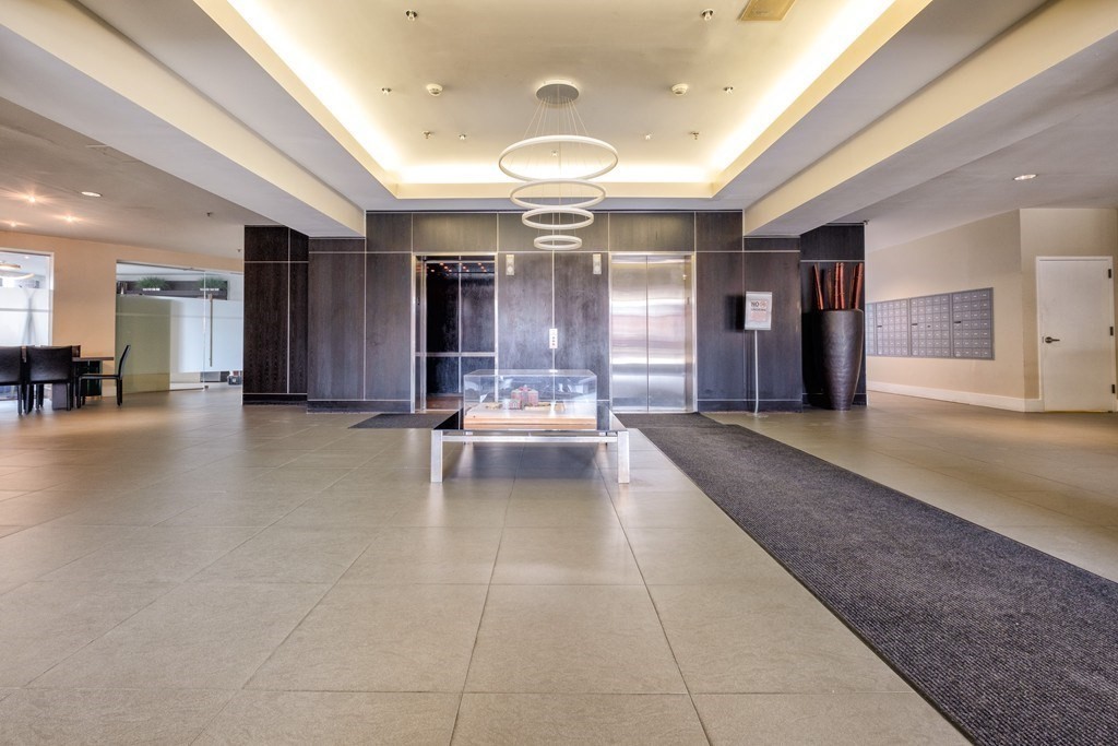 15 North Beacon Street, Unit 217 Boston, MA 02134 - Photo 11 of 21 a lobby with entryway and a potted plant