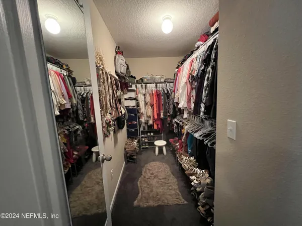 a view of a closet with storage