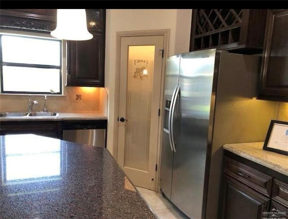 2720 Fairmont Avenue McAllen, TX 78504 - Photo 14 of 35 a kitchen with a refrigerator and a sink