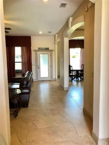 a lobby with furniture and dining area