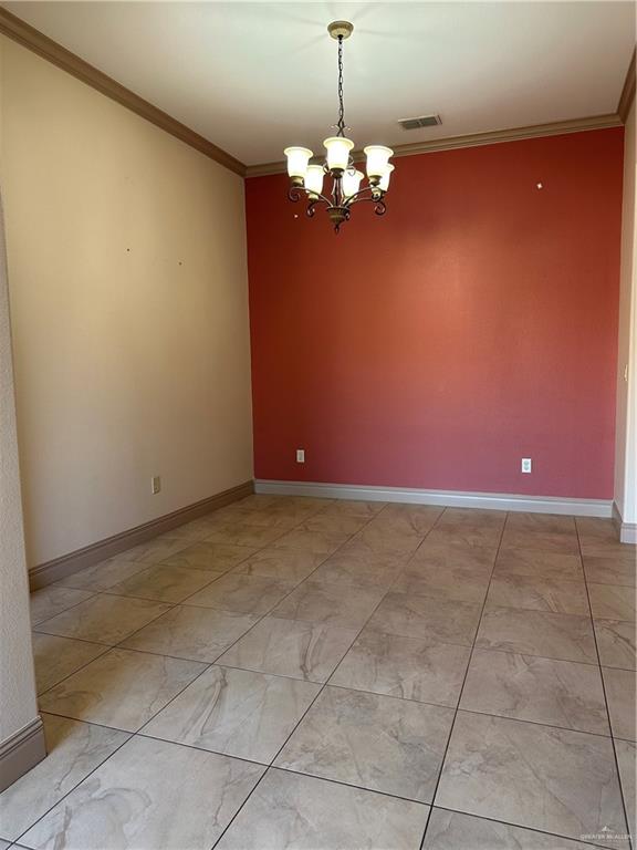 2720 Fairmont Avenue McAllen, TX 78504 - Photo 22 of 35 a view of a livingroom with a chandelier fan