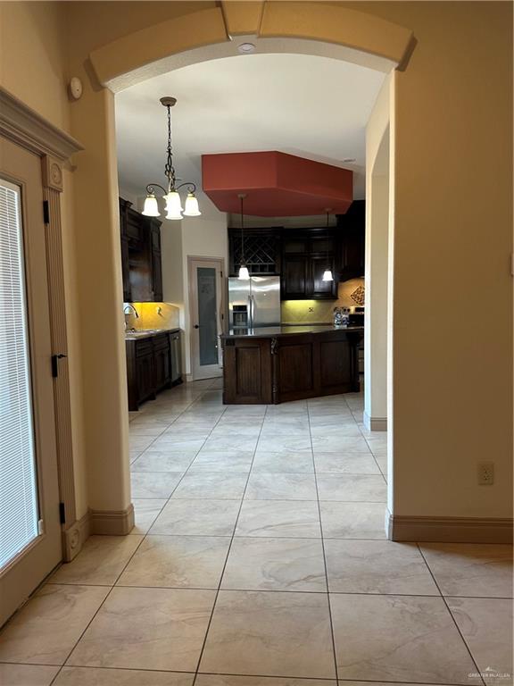 2720 Fairmont Avenue McAllen, TX 78504 - Photo 23 of 35 a kitchen view with granite countertop a rug a stove and a shower