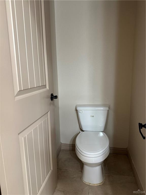 2720 Fairmont Avenue McAllen, TX 78504 - Photo 25 of 35 a bathroom with a toilet and a sink