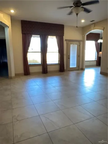 a bathroom with a granite countertop sink a toilet and a mirror