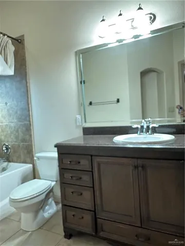 a bathroom with a sink a toilet and a bathtub
