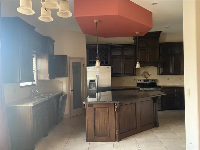 a kitchen with a sink and cabinets