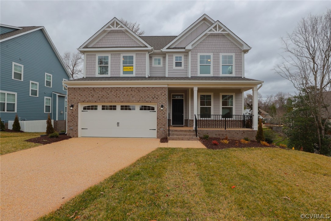 4357 Landfall Drive Williamsburg, VA 23185 - Photo 1 of 44 a front view of a house with a yard and garage