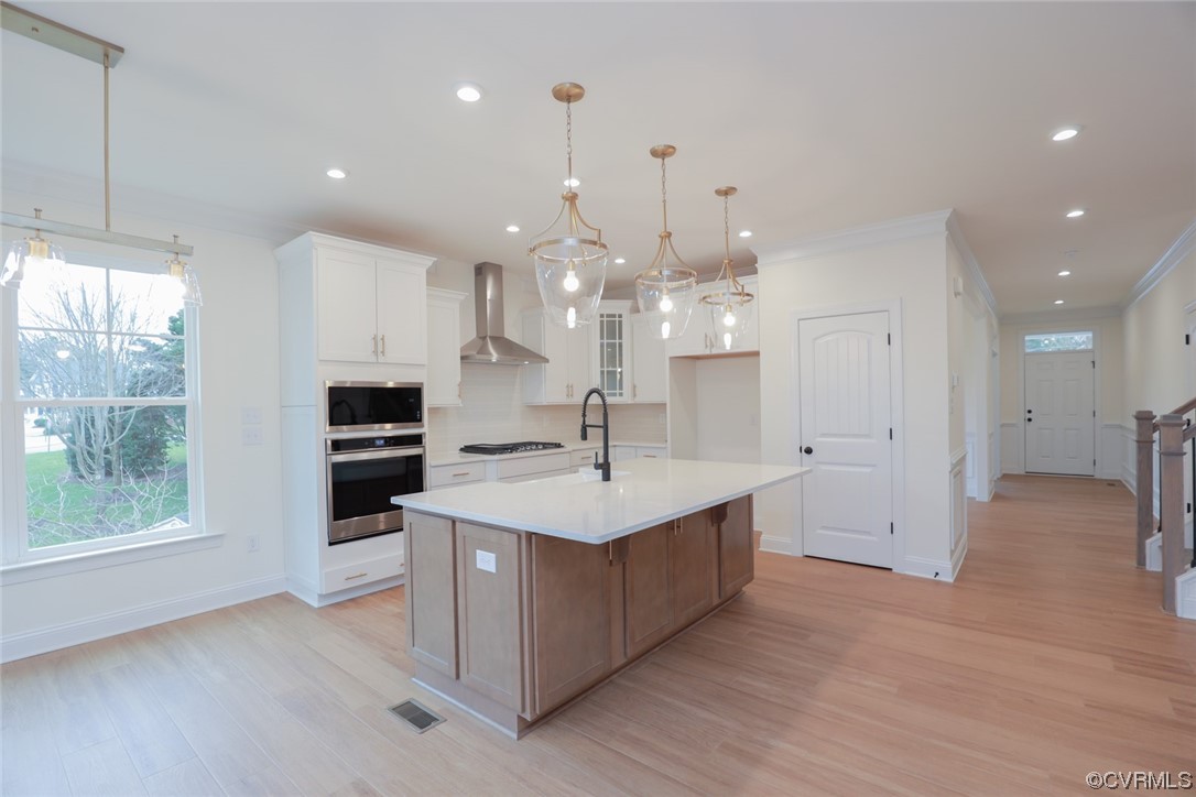 4357 Landfall Drive Williamsburg, VA 23185 - Photo 11 of 44 a kitchen with kitchen island a sink stainless steel appliances and window