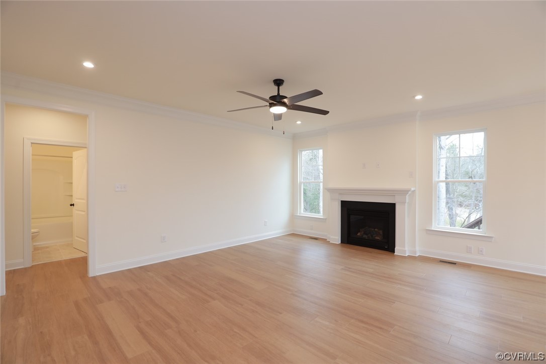 4357 Landfall Drive Williamsburg, VA 23185 - Photo 15 of 44 a view of an empty room with a fireplace and a window