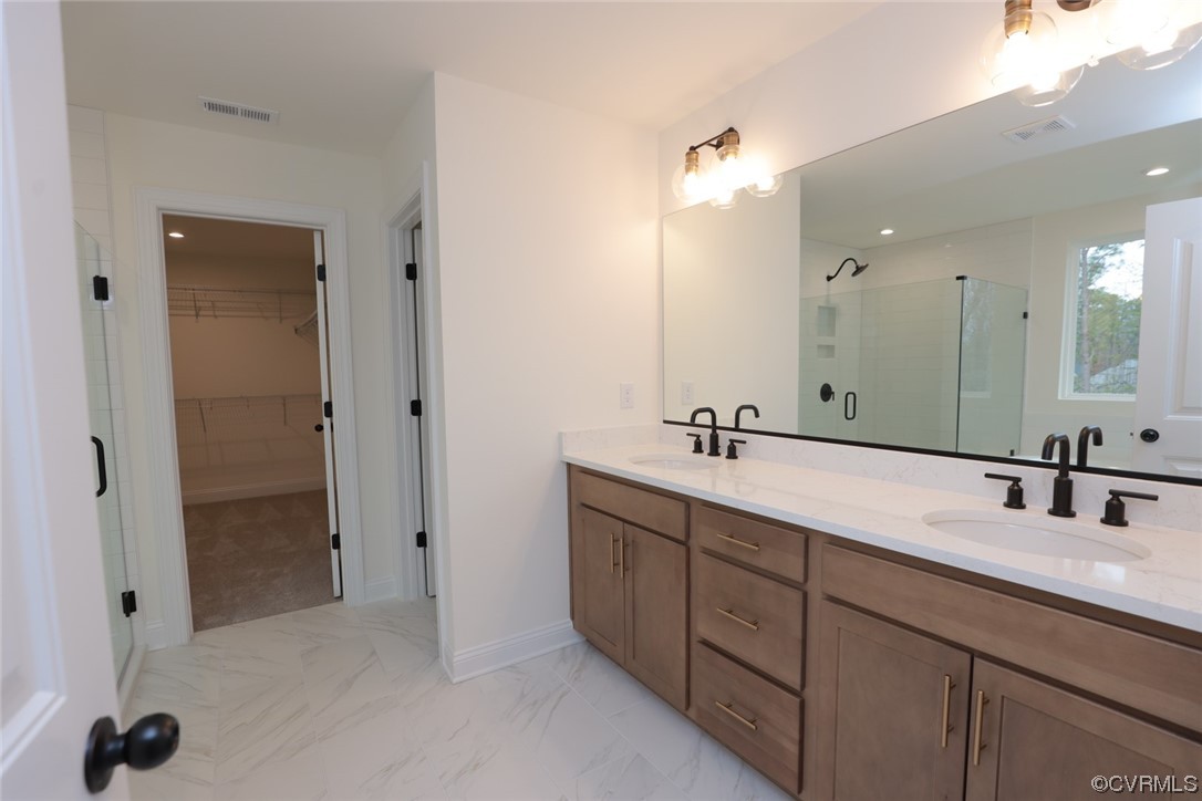 4357 Landfall Drive Williamsburg, VA 23185 - Photo 23 of 44 a bathroom with double vanity sinks and a shower