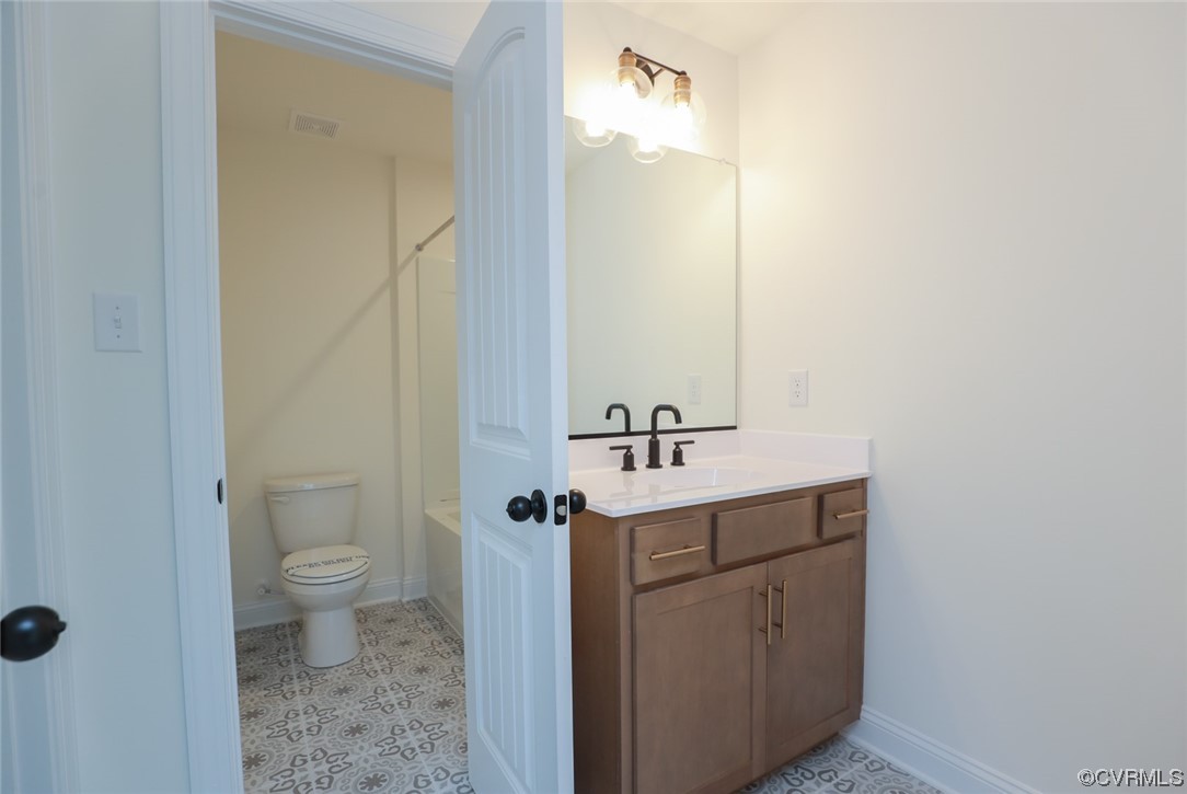 4357 Landfall Drive Williamsburg, VA 23185 - Photo 30 of 44 a bathroom with a toilet a sink and mirror